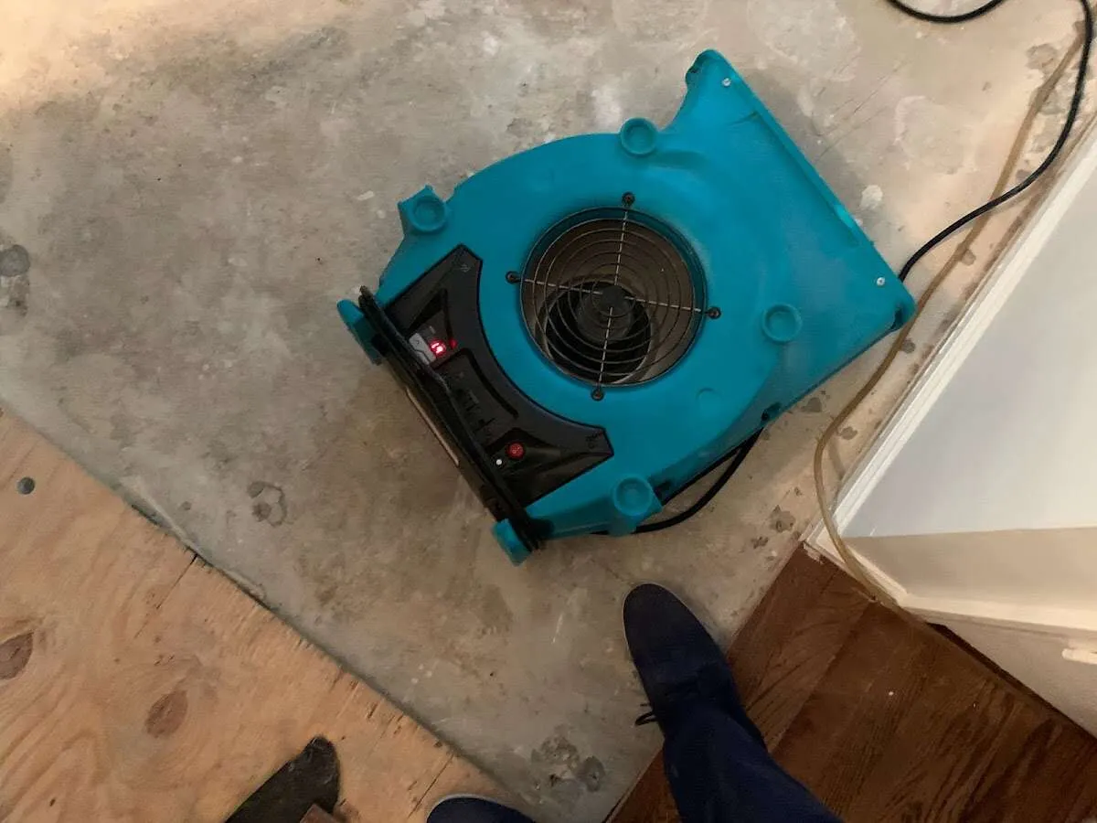 Air mover drying subfloor during Leak Detection & Repair in Mentor-on-the-Lake